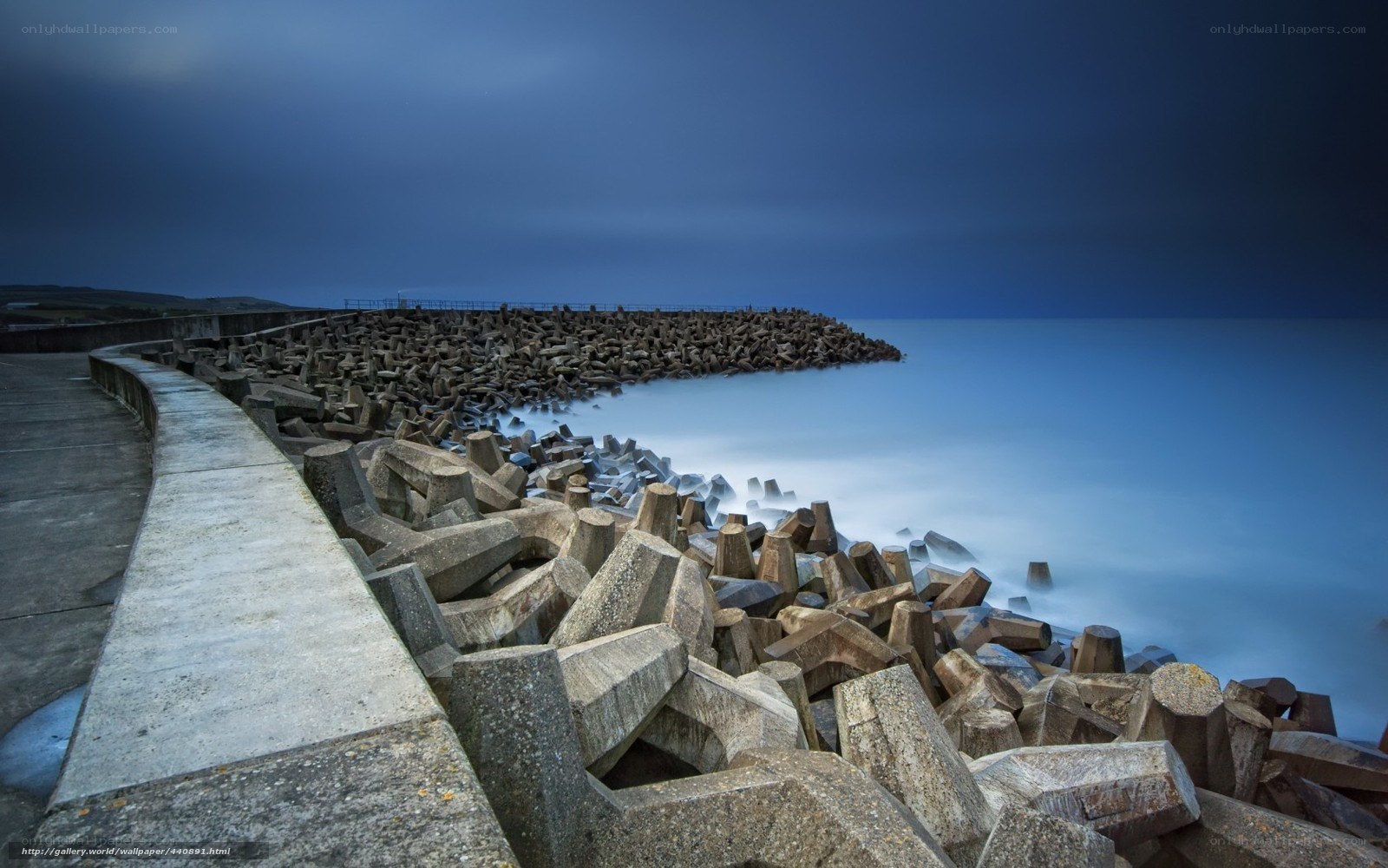 Concrete breakwater at dusk