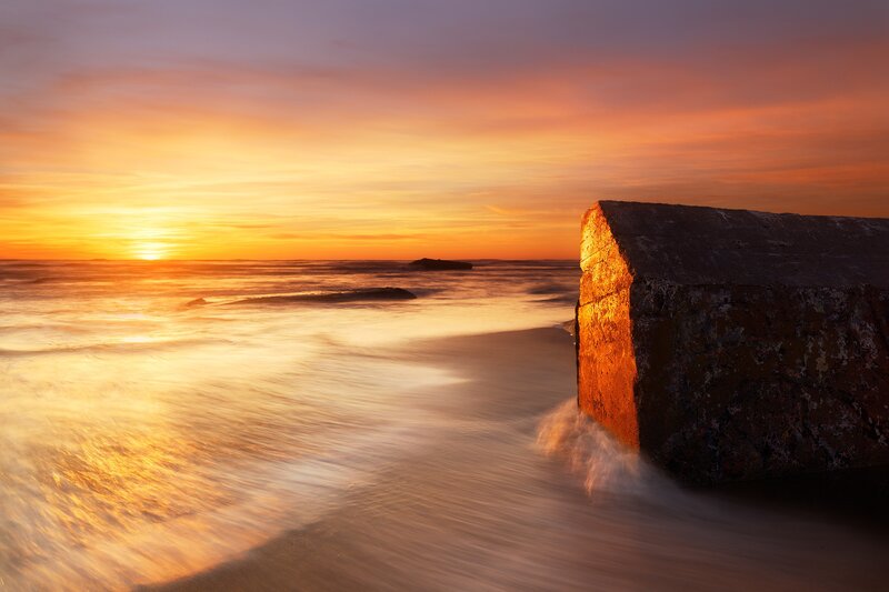 Concrete Breakwater at Sunset — Orange