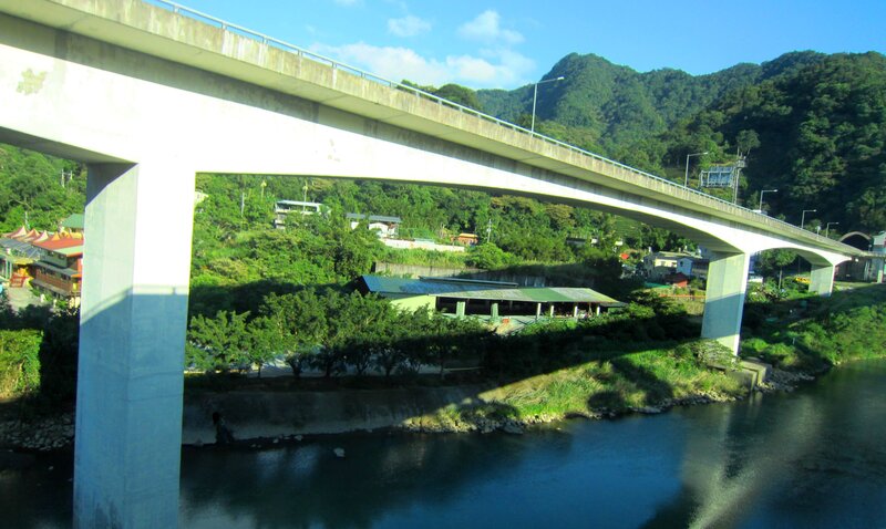 Concrete Bridge over River — Green, Serene, Afternoon