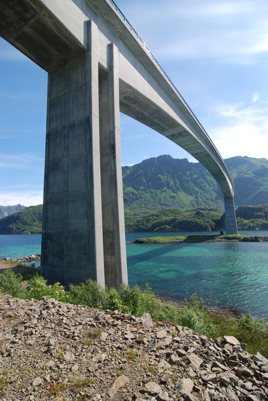 Concrete bridge over turquoise water