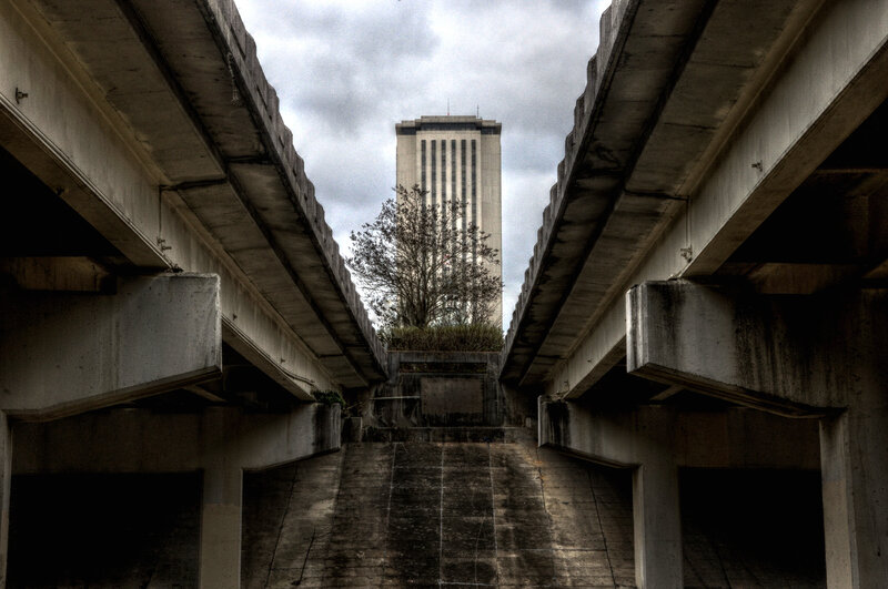 Concrete bridge view of a tall building