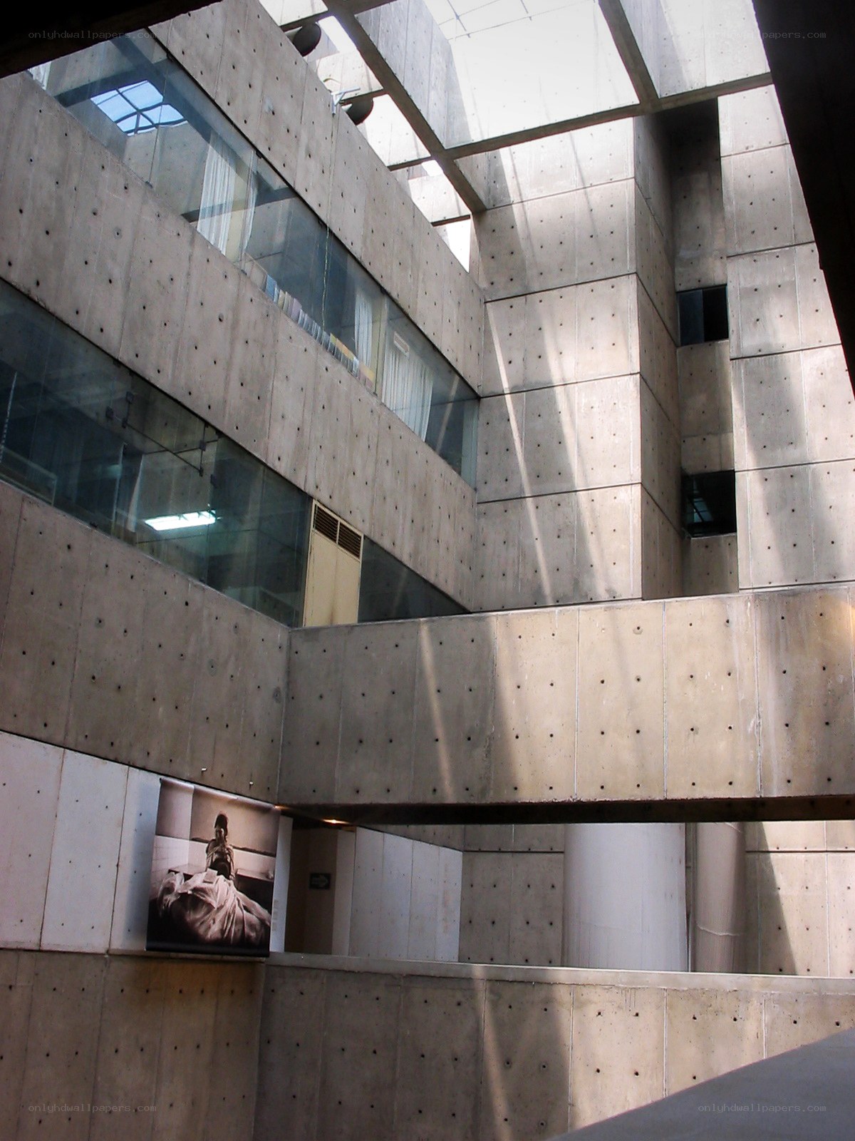 Concrete building interior with skylight