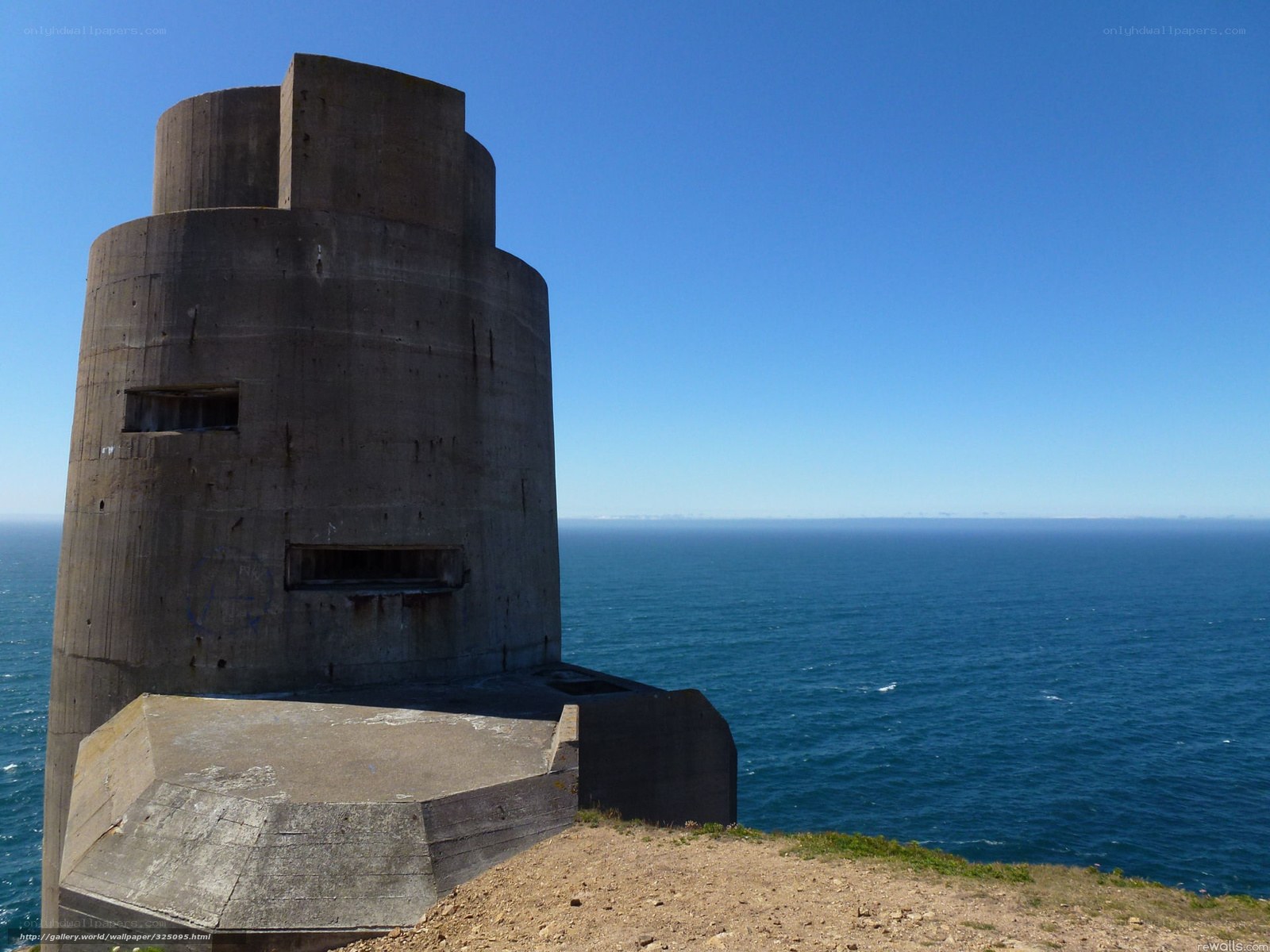 Concrete bunker on coastal cliff