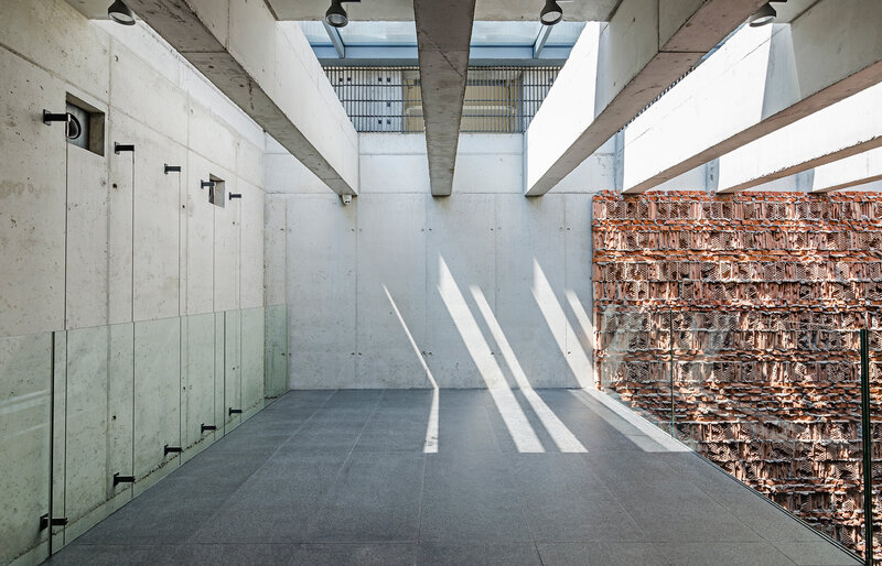 Concrete Corridor with Brick Wall