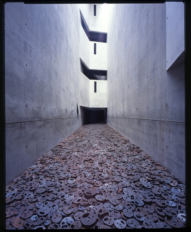 Concrete corridor with metal discs