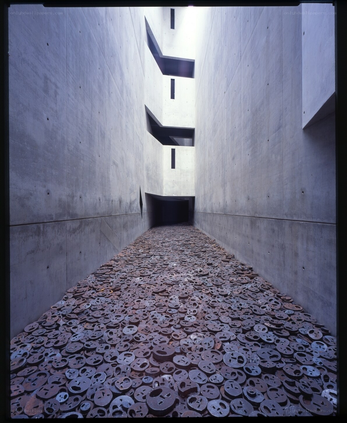 Concrete corridor with metal discs