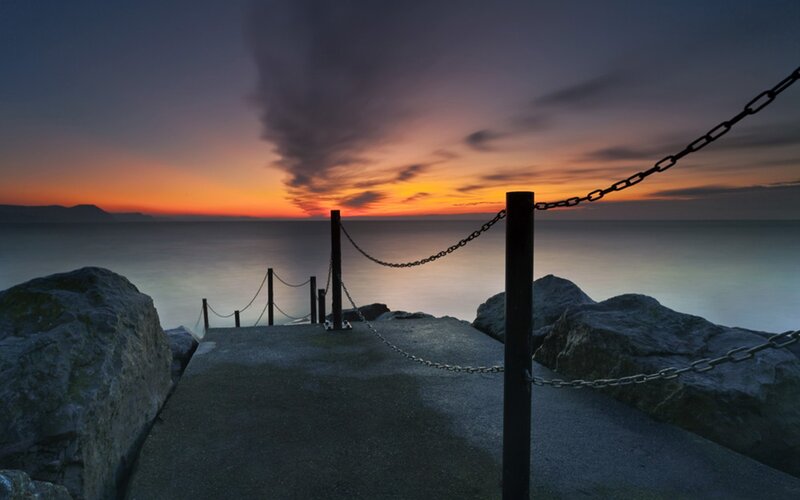 Concrete Pier at Sunset — Orange, Serene, Photograph