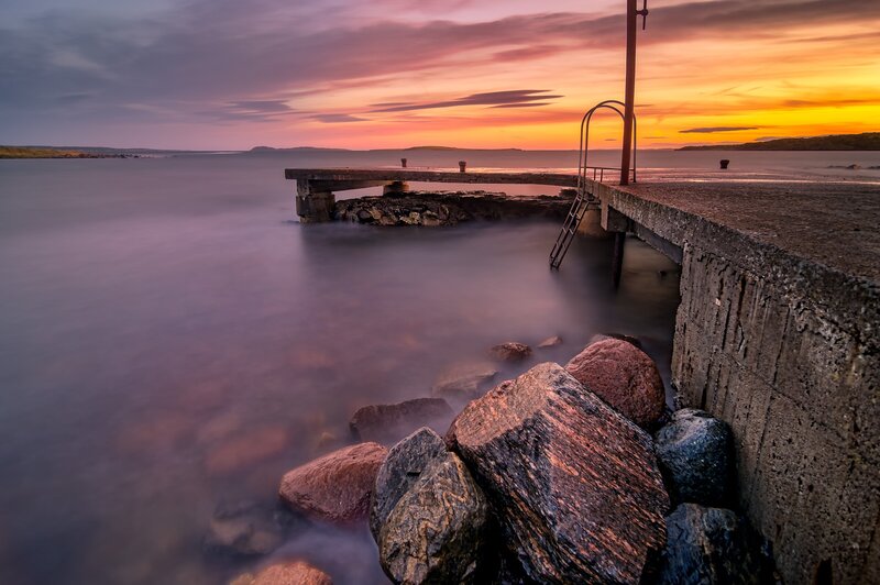 Concrete Pier at Sunset — Orange, Serene