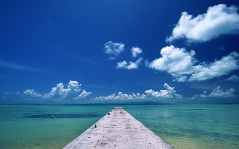 Concrete Pier Extending into Sea — Blue, Serene