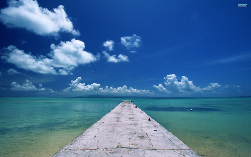 Concrete Pier Extending into Sea — Blue