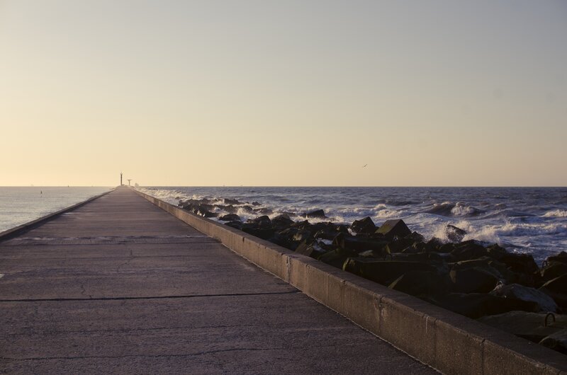Concrete Pier Extending into Sea — Gray, Serene