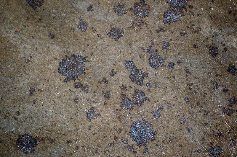 concrete surface with oil stains