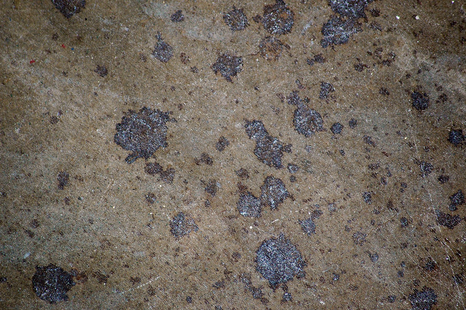 concrete surface with oil stains