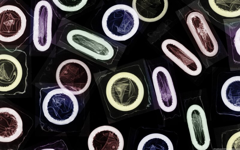 Condoms in Packaging — Black, Abstract, Photograph