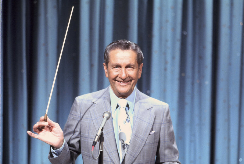 Conductor on stage with baton