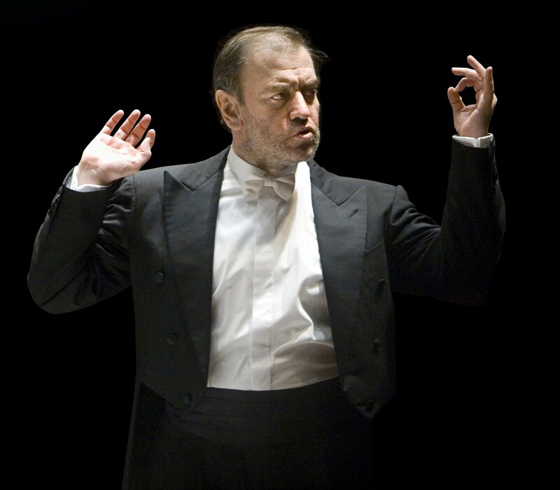 Conductor performing on stage