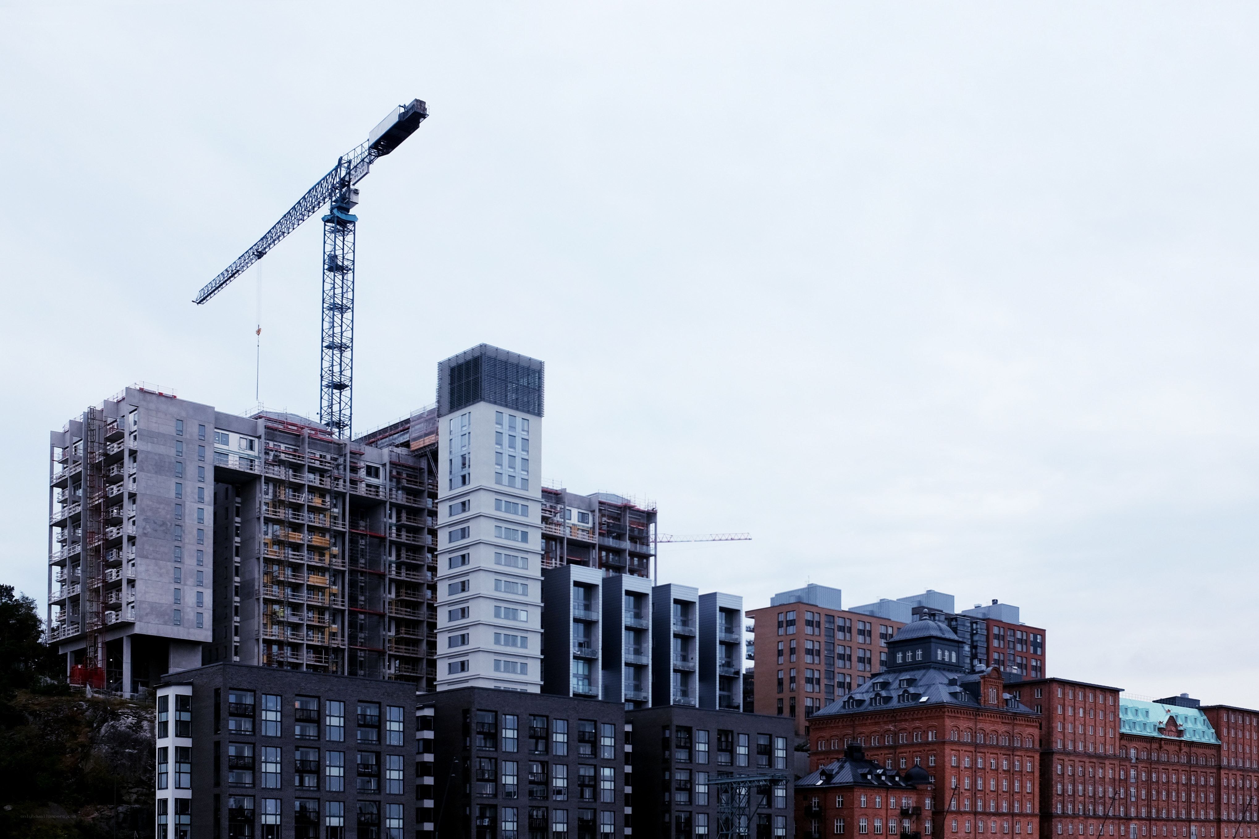 Construction crane over city buildings