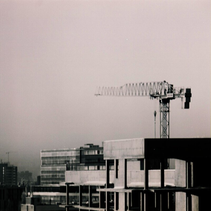 Construction crane over city