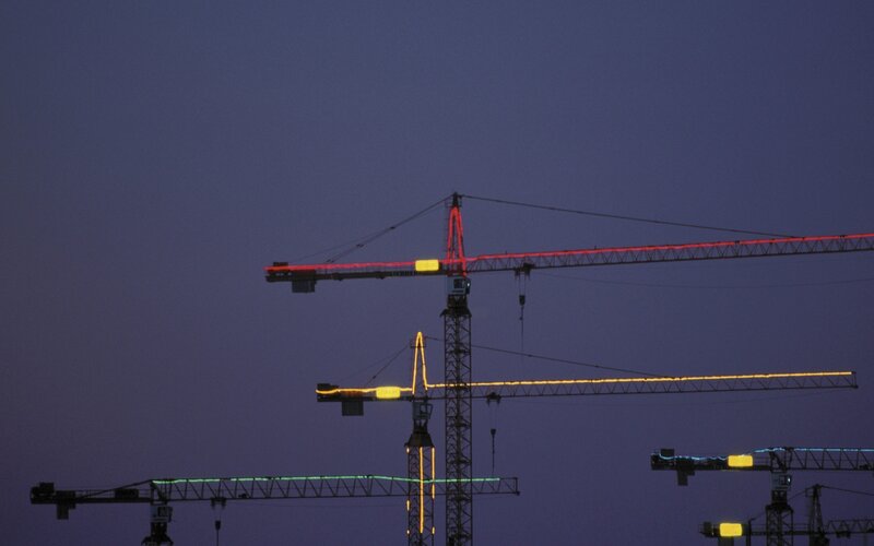 Construction Cranes at Dusk — Purple
