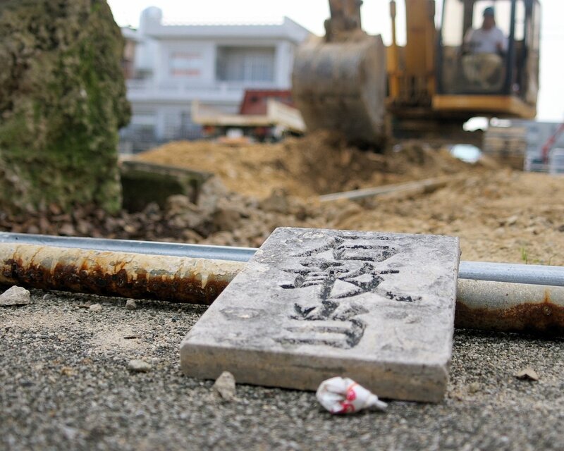 Construction site with stone marker