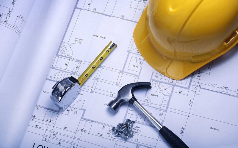 Construction Tools on Blueprint — Yellow