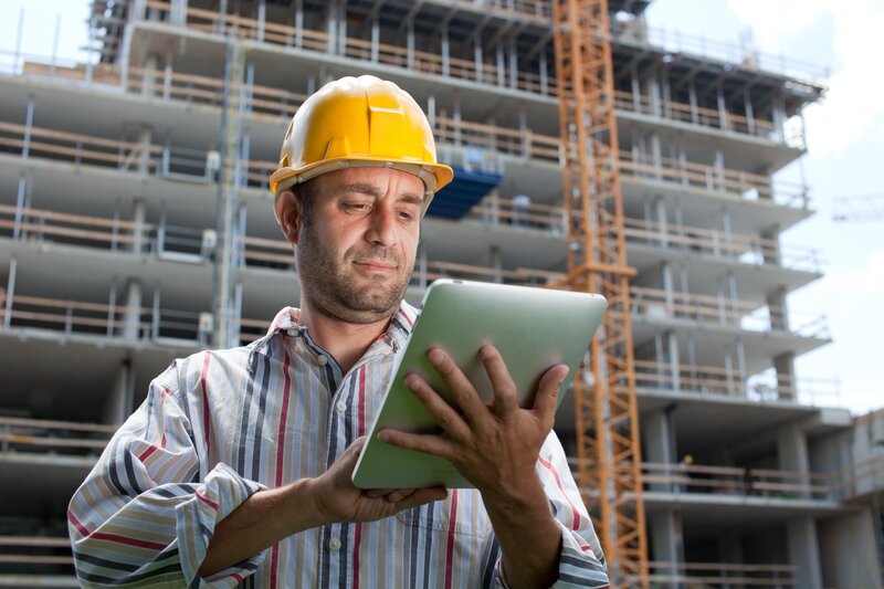 Construction worker using tablet