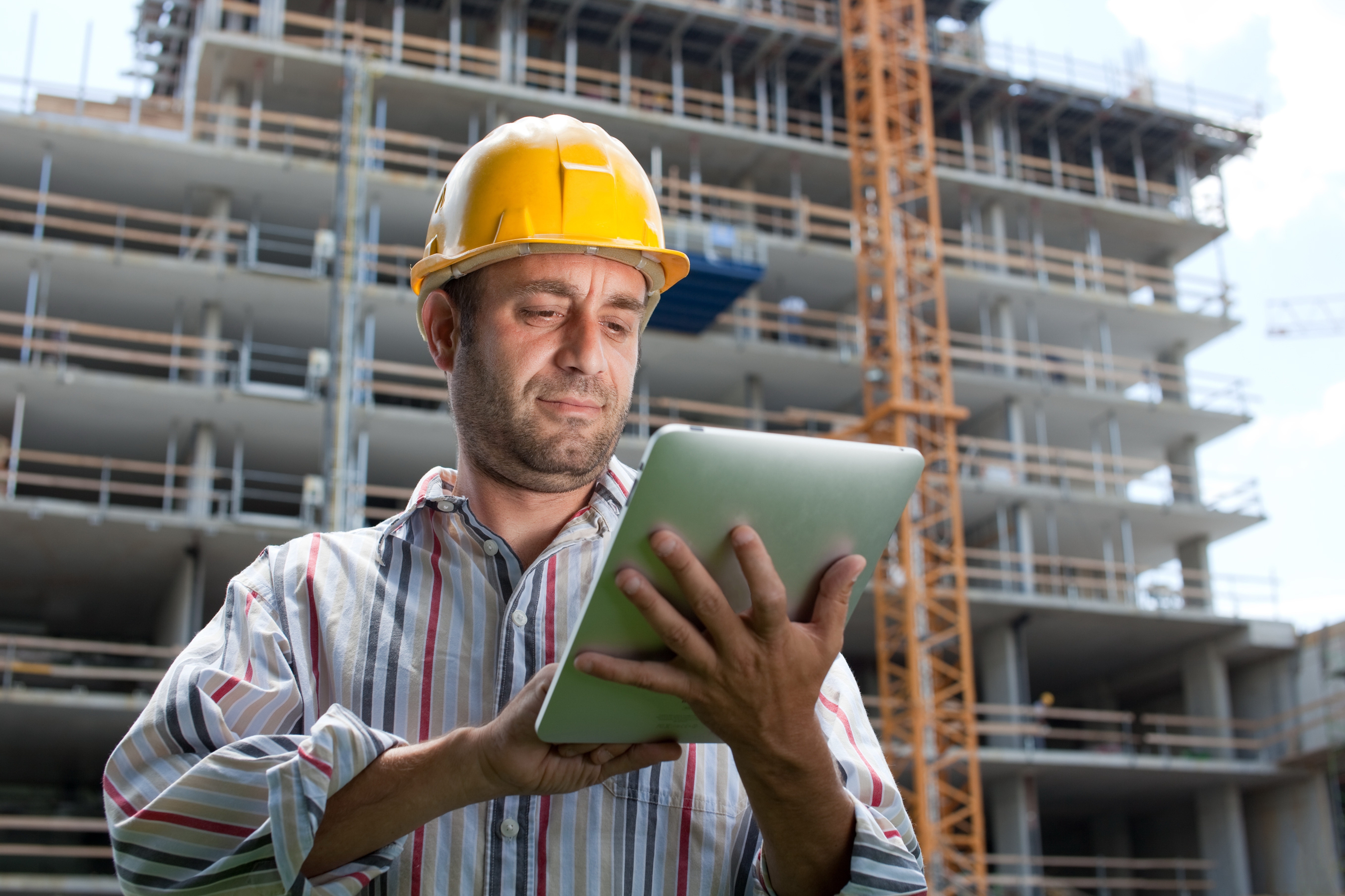 Construction worker using tablet