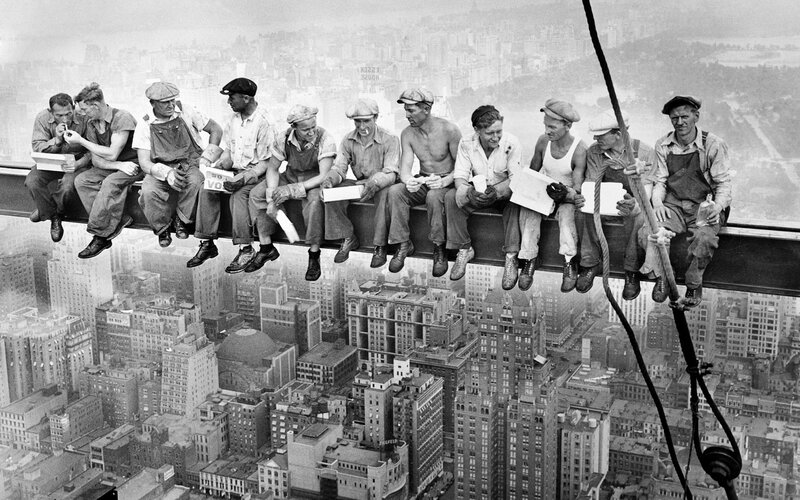 Construction workers on beam