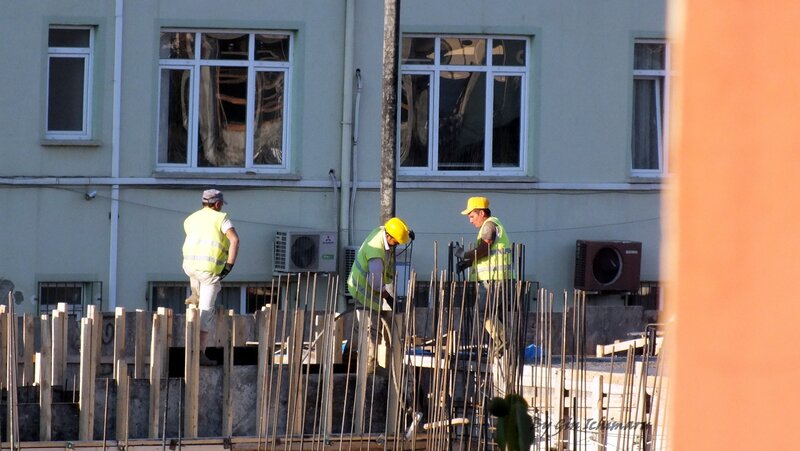 Construction Workers on Site — Green
