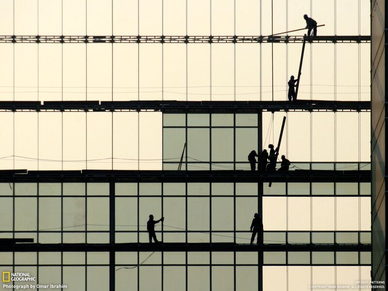 Construction workers silhouetted