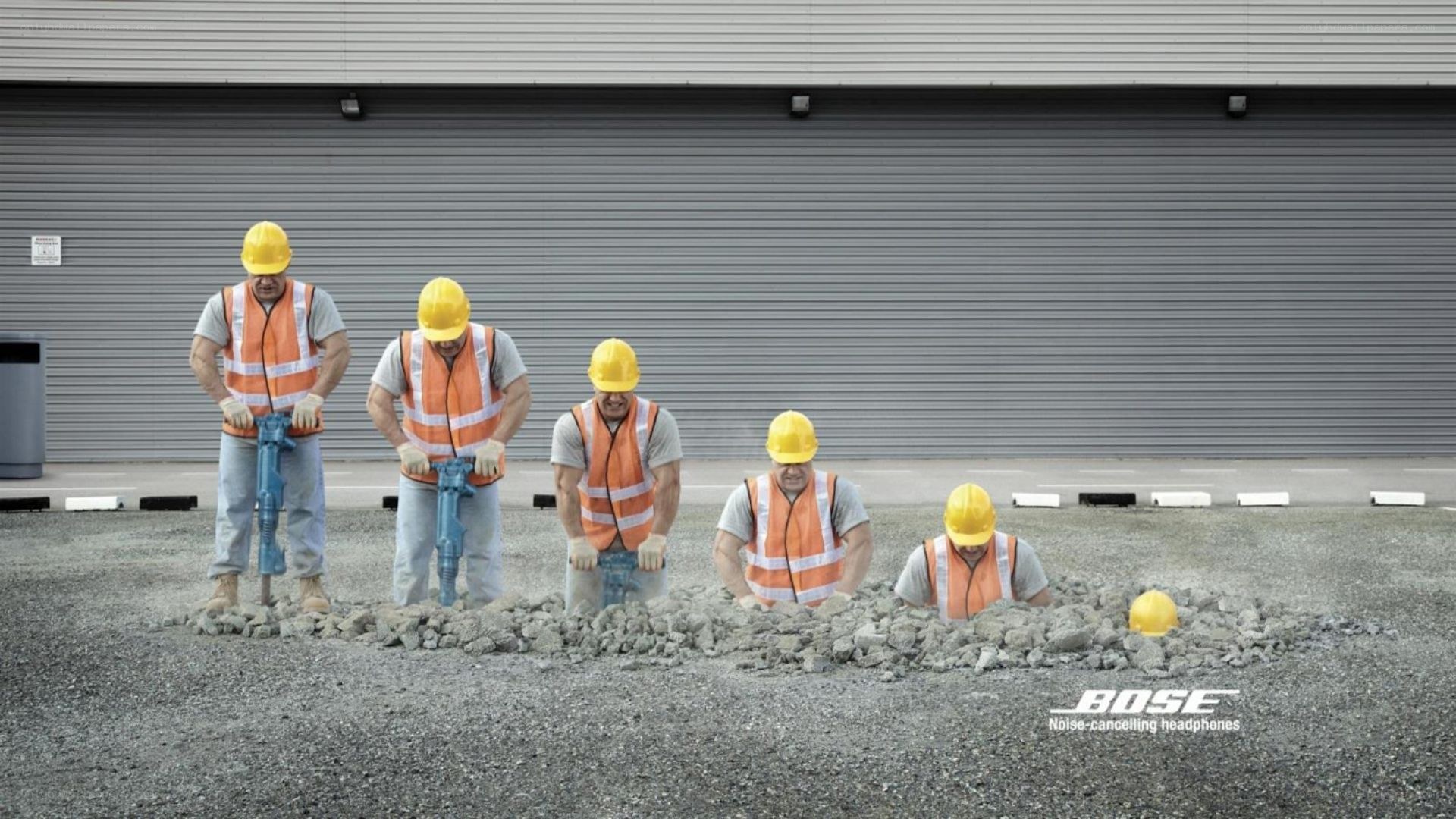 Construction workers with headphones