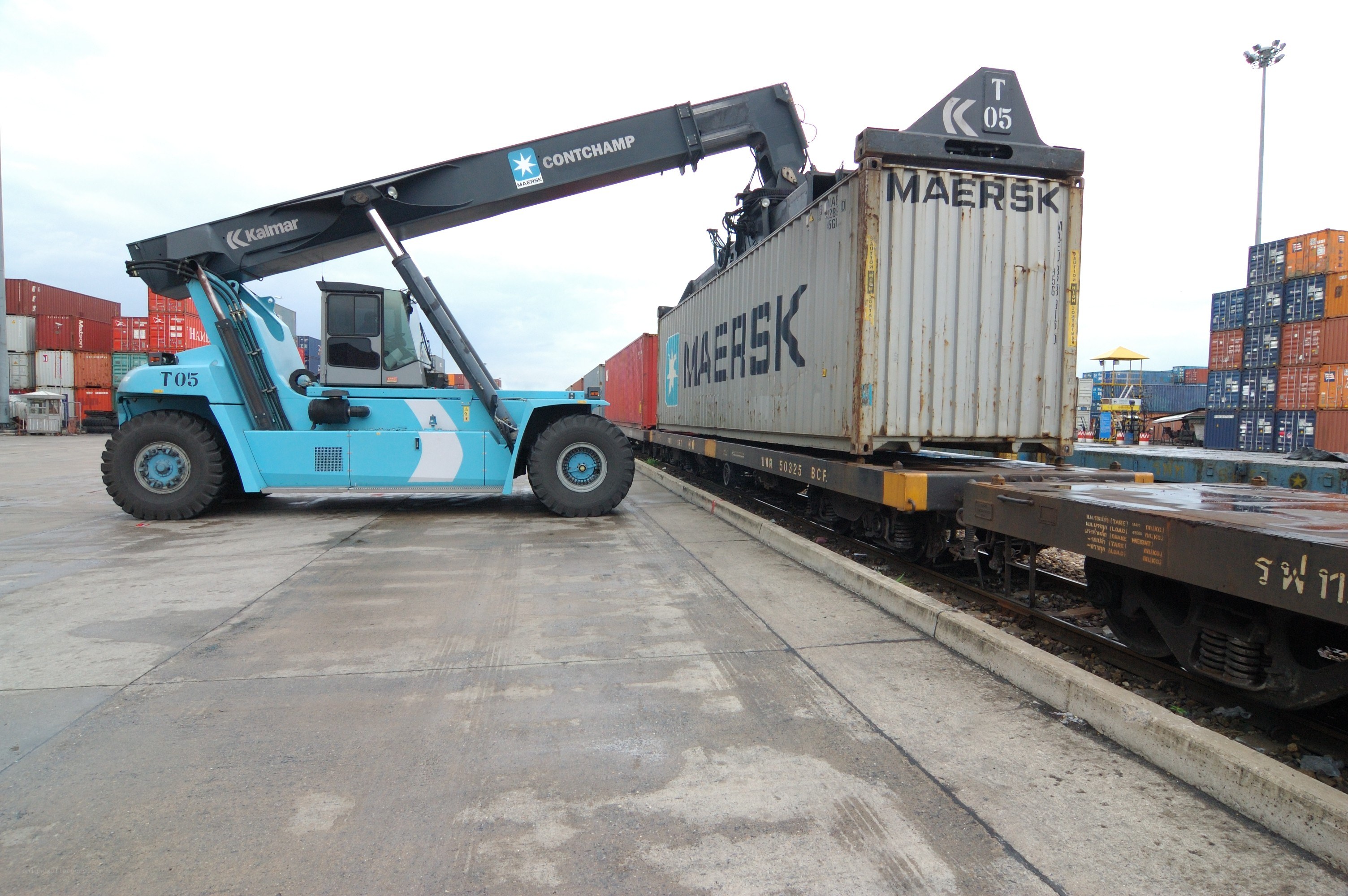 Container being loaded onto train