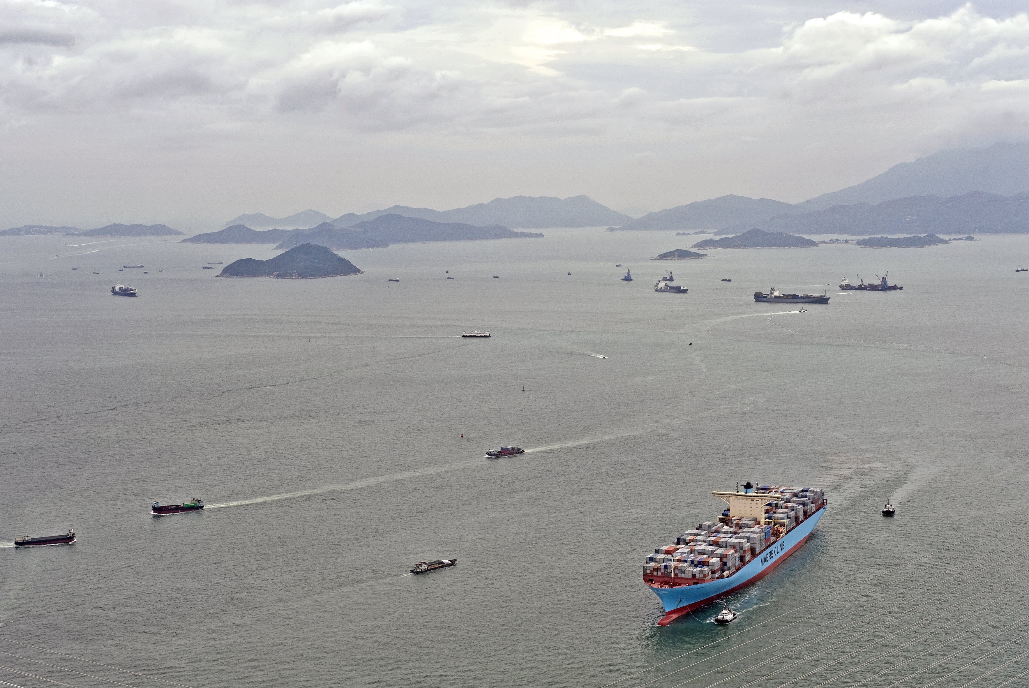 Container ship in busy harbor