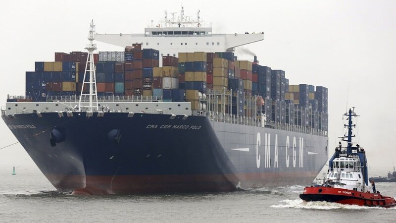 Container ship with tugboat