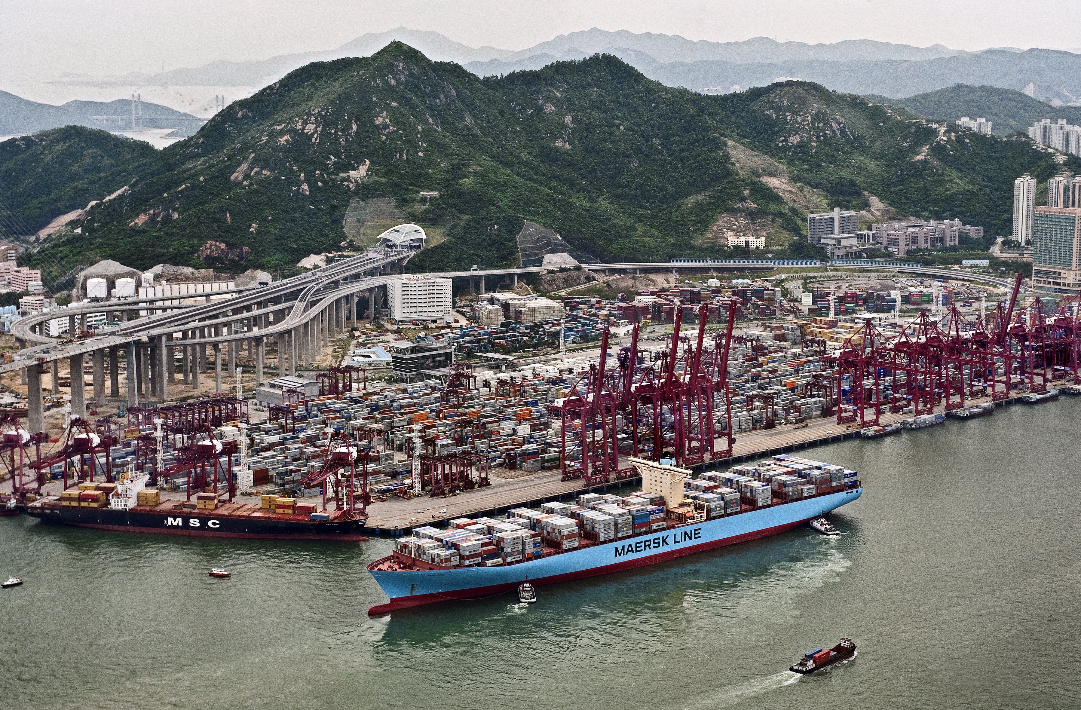 Container ships at a busy port