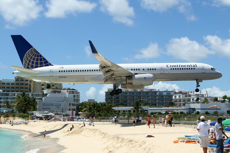 Continental airplane landing near beach