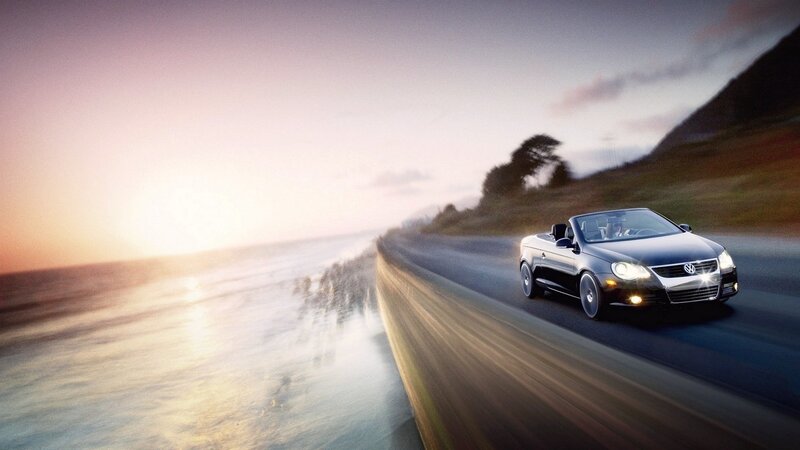 convertible car on coastal road
