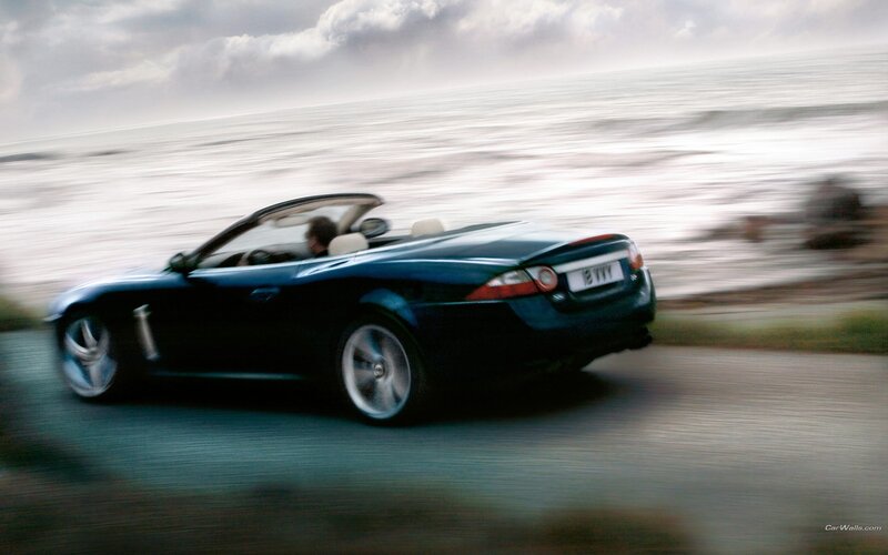 convertible car on coastal road