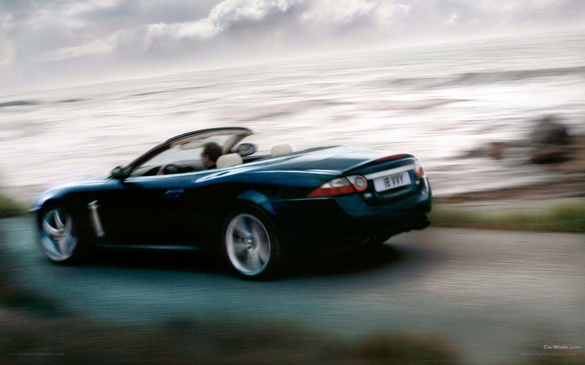 convertible car on coastal road