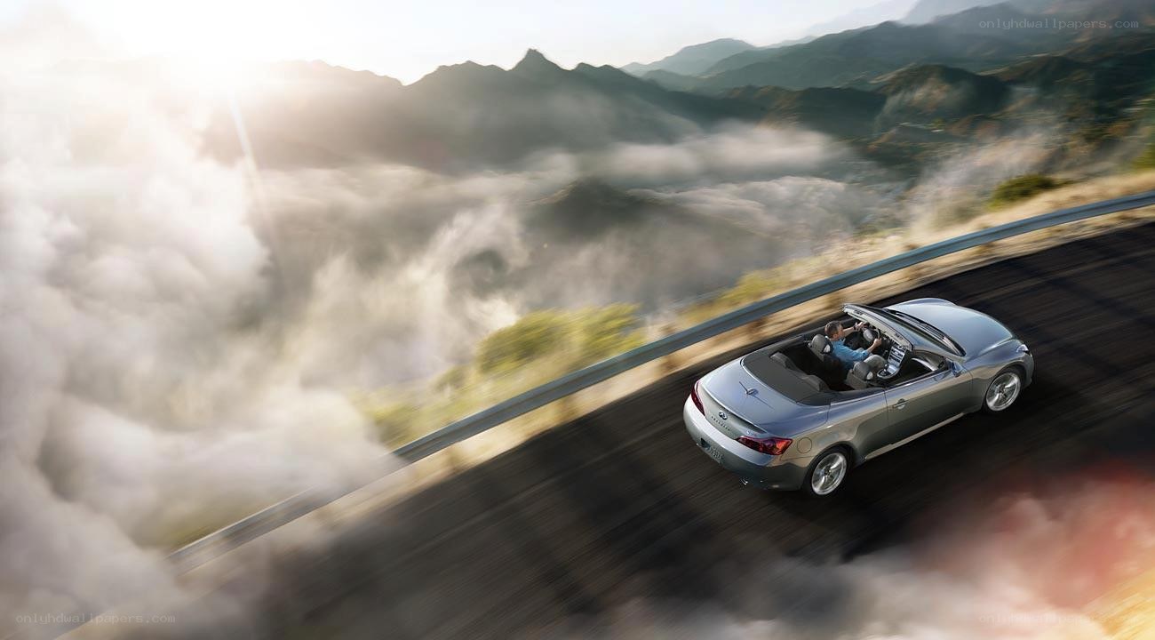 convertible car on mountain road