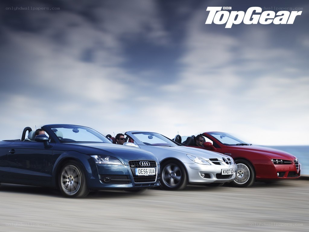 convertible cars on a road