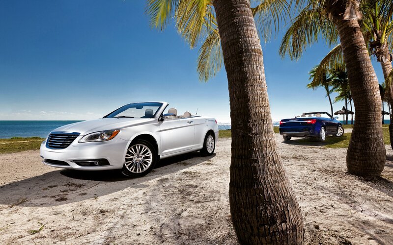 Convertibles on a tropical beach