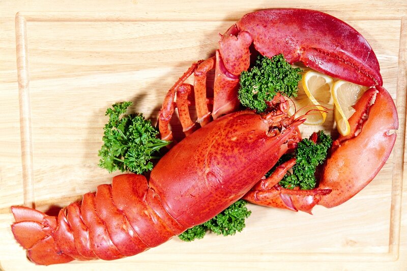 Cooked lobster on wooden board