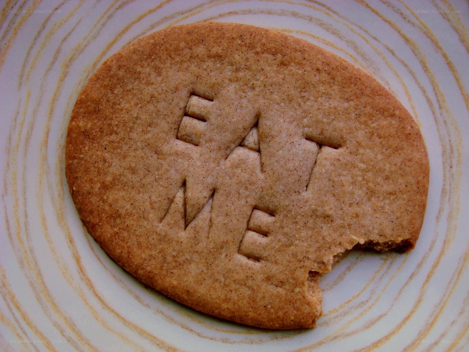 cookie with 'eat me' text