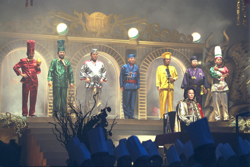 Cooks on stage in colorful uniforms