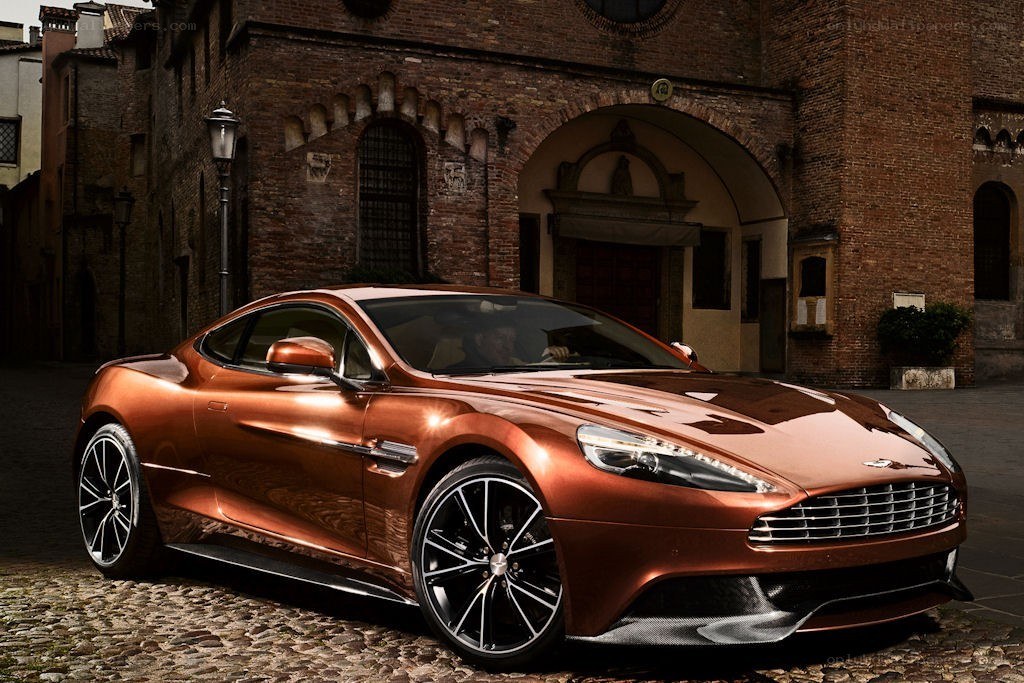 Copper Aston Martin in historic setting
