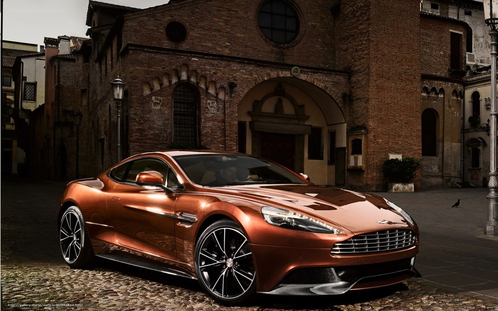 Copper Aston Martin in historic square