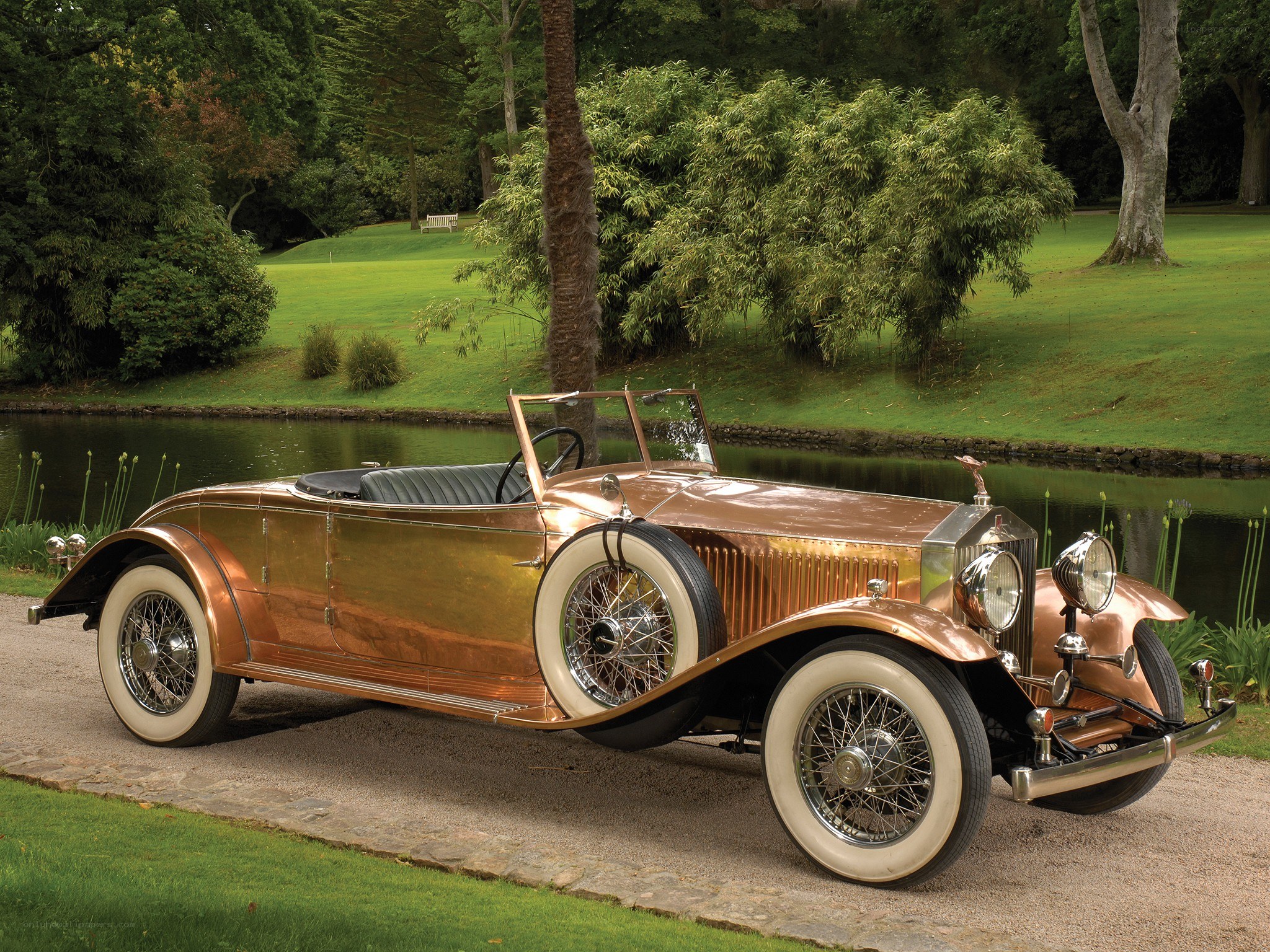 Copper Rolls-Royce on a gravel path