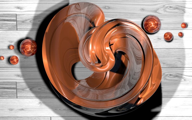 Copper spiral sculpture on wood