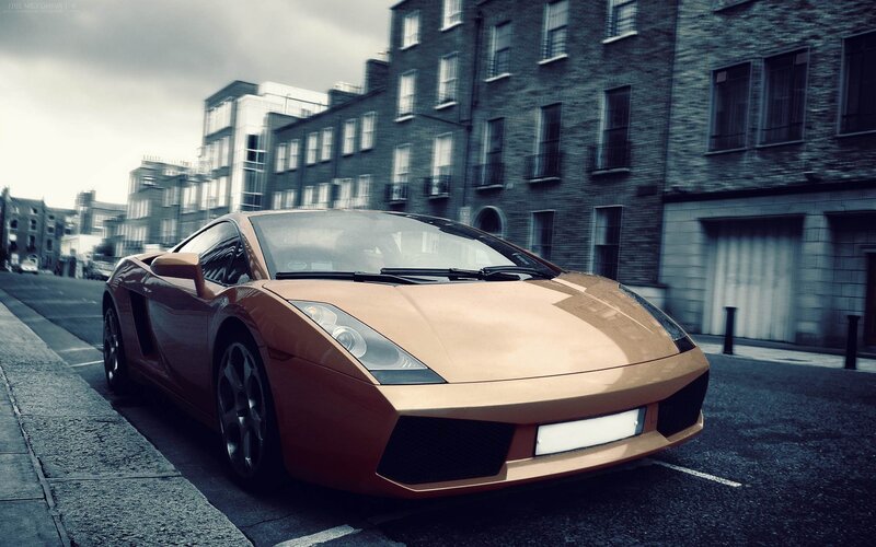 Copper sports car on city street